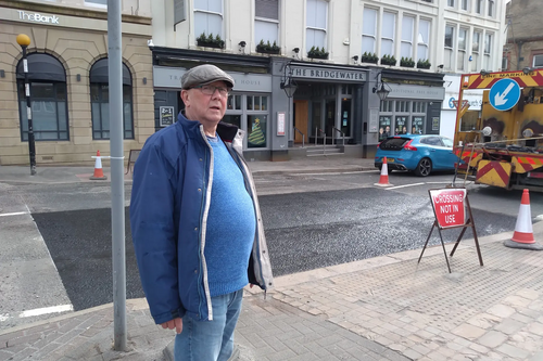 Cllr Davies at the crossing on Railway Rd