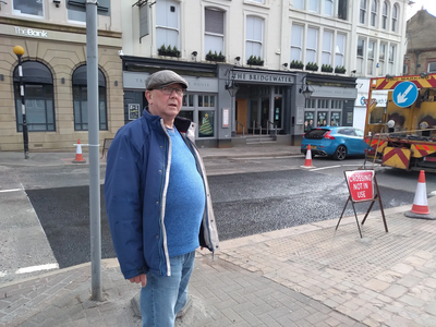 Cllr Davies at the crossing on Railway Rd